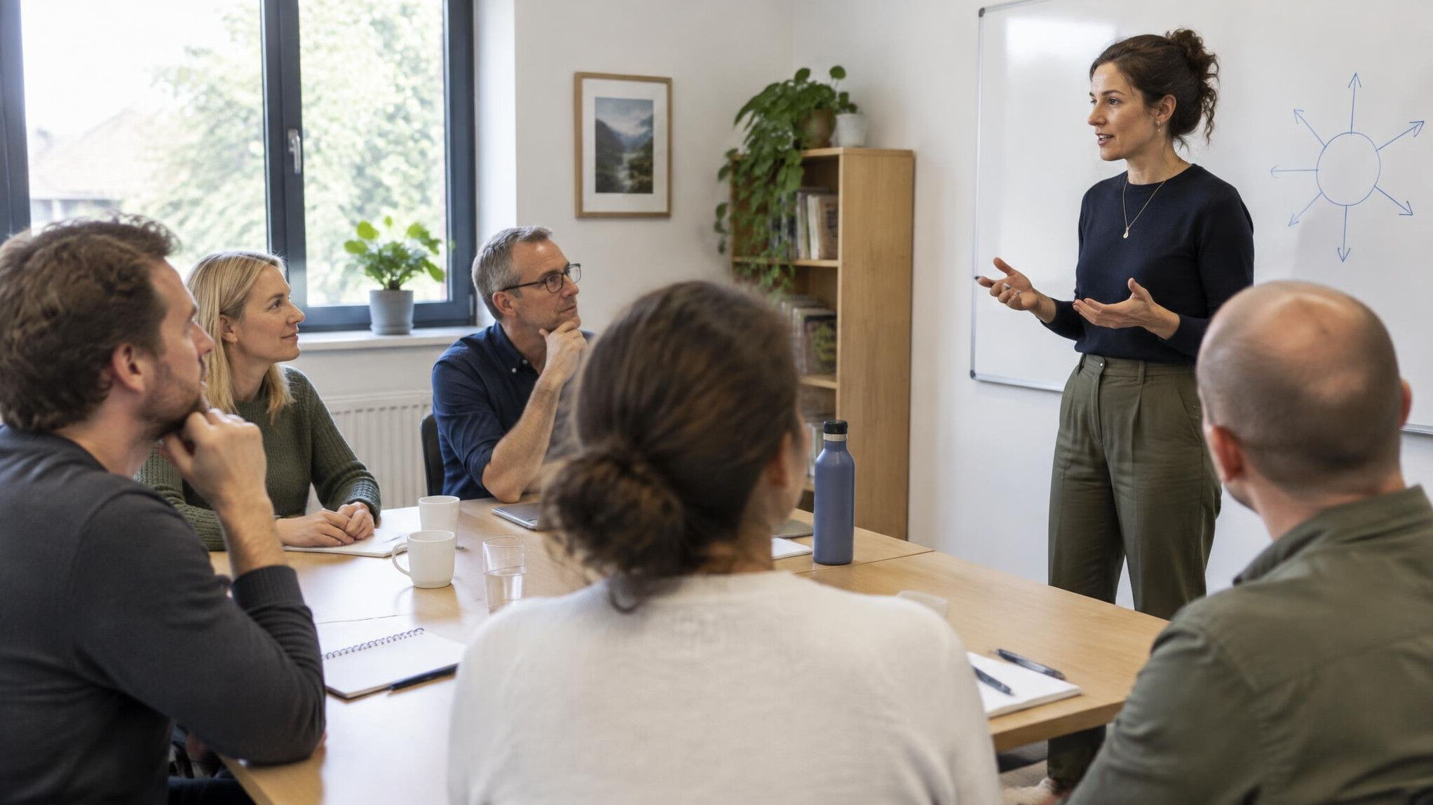Workshop with people listening to a speaker